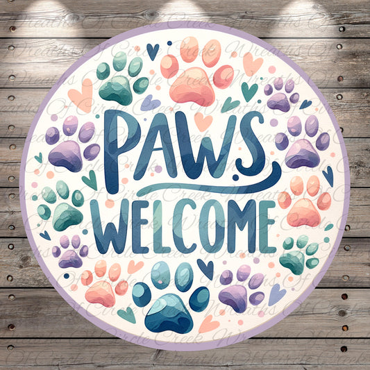 A circular sign with the text "Paws Welcome" surrounded by various paw prints in different colors, including blue, green, purple, and orange.