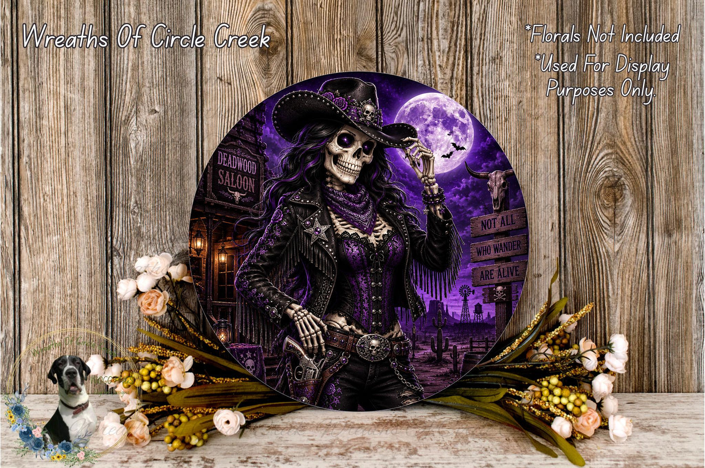 a skull wearing a cowboy hat and holding a gun, surrounded by flowers and a sign that reads "Deadwood Saloon".