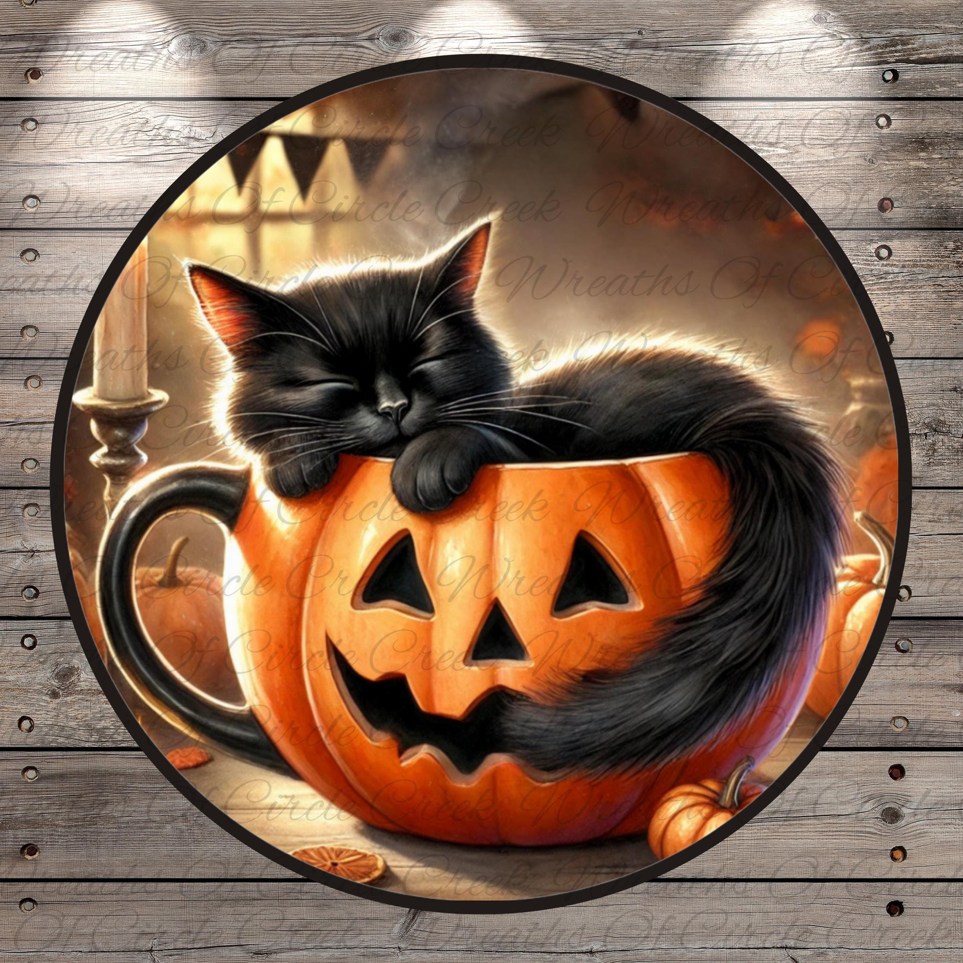 A black cat is curled up and sleeping inside a carved pumpkin, surrounded by other pumpkins and a candle on a wooden surface.