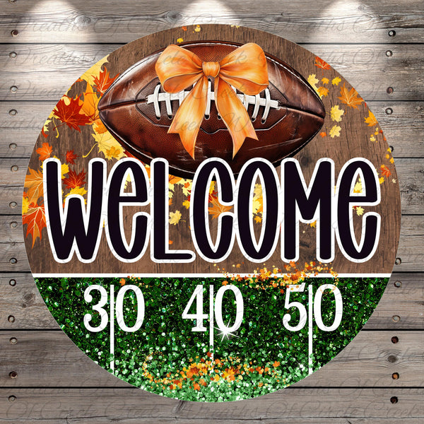 A welcome sign with a football and autumn leaves, along with the text "Welcome" and numbers "310 40 50".