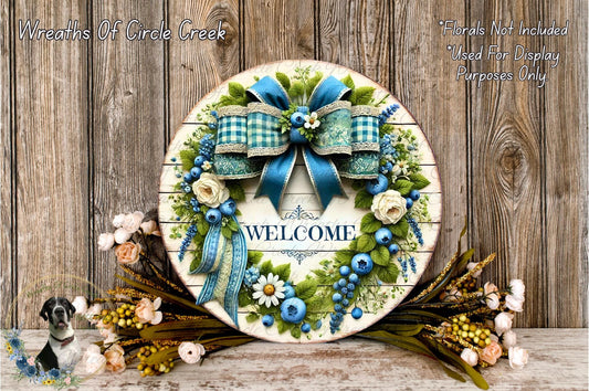 a welcome sign with a blue bow and flowers