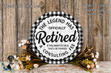 a decorative sign with the text "The Legend Has Officially Retired" surrounded by a floral arrangement on a wooden surface.