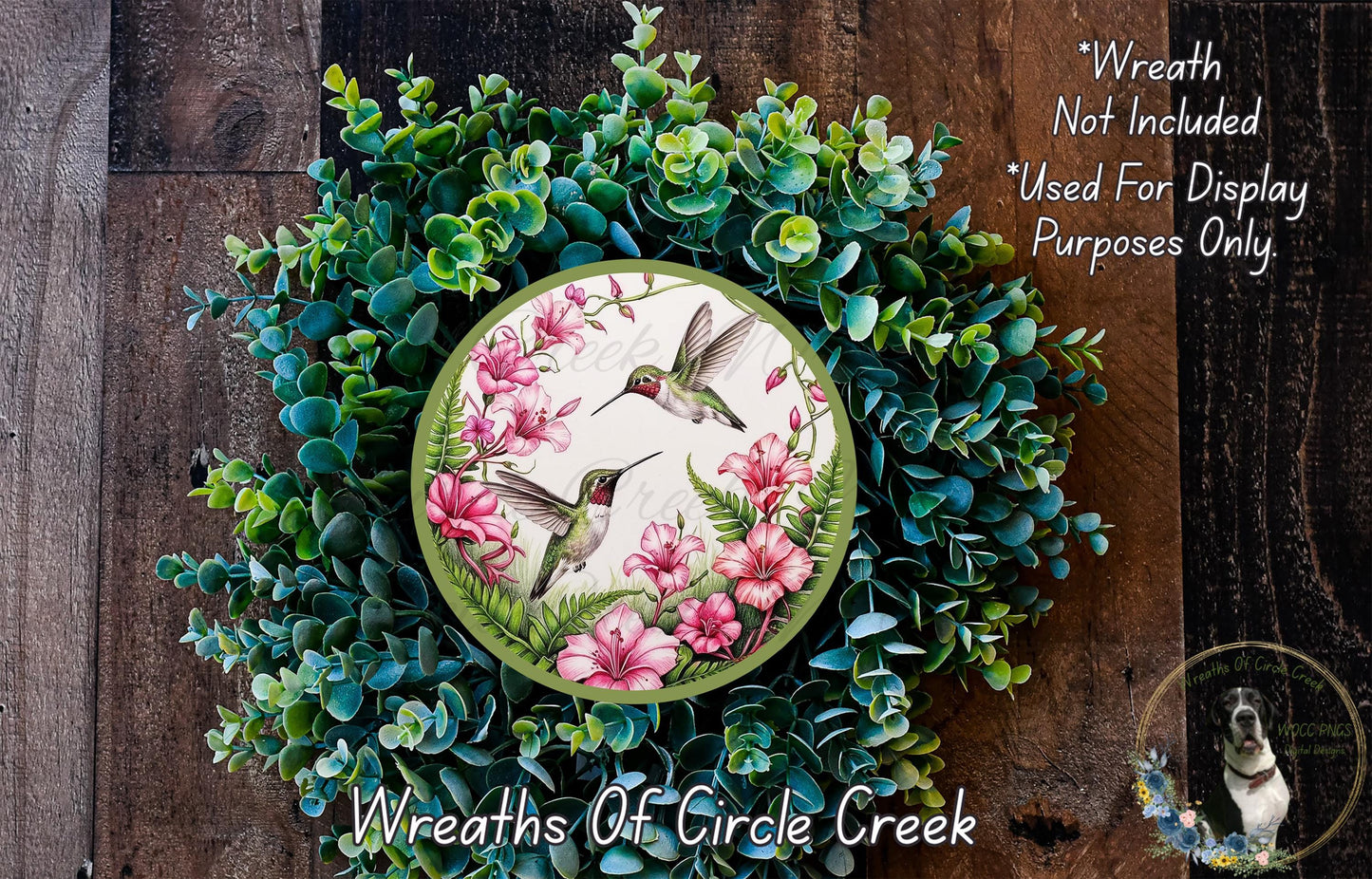 a picture of a wreath with flowers and birds on it