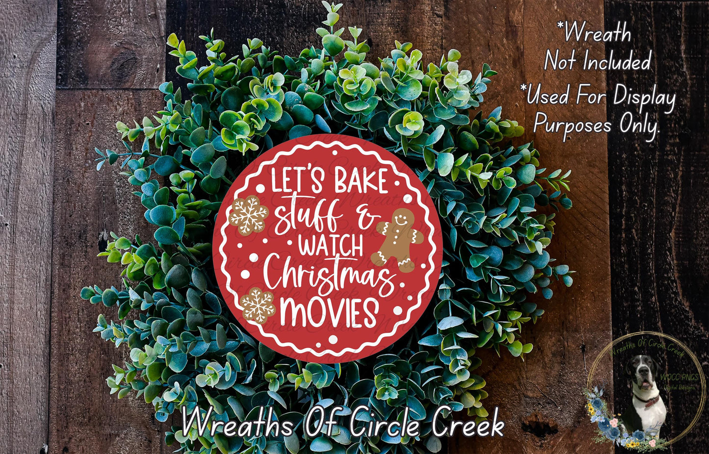 A wreath made of green leaves and a red circular sign with the text "Let's Bake Stuff & Watch Christmas Movies" is displayed on a wooden background.
