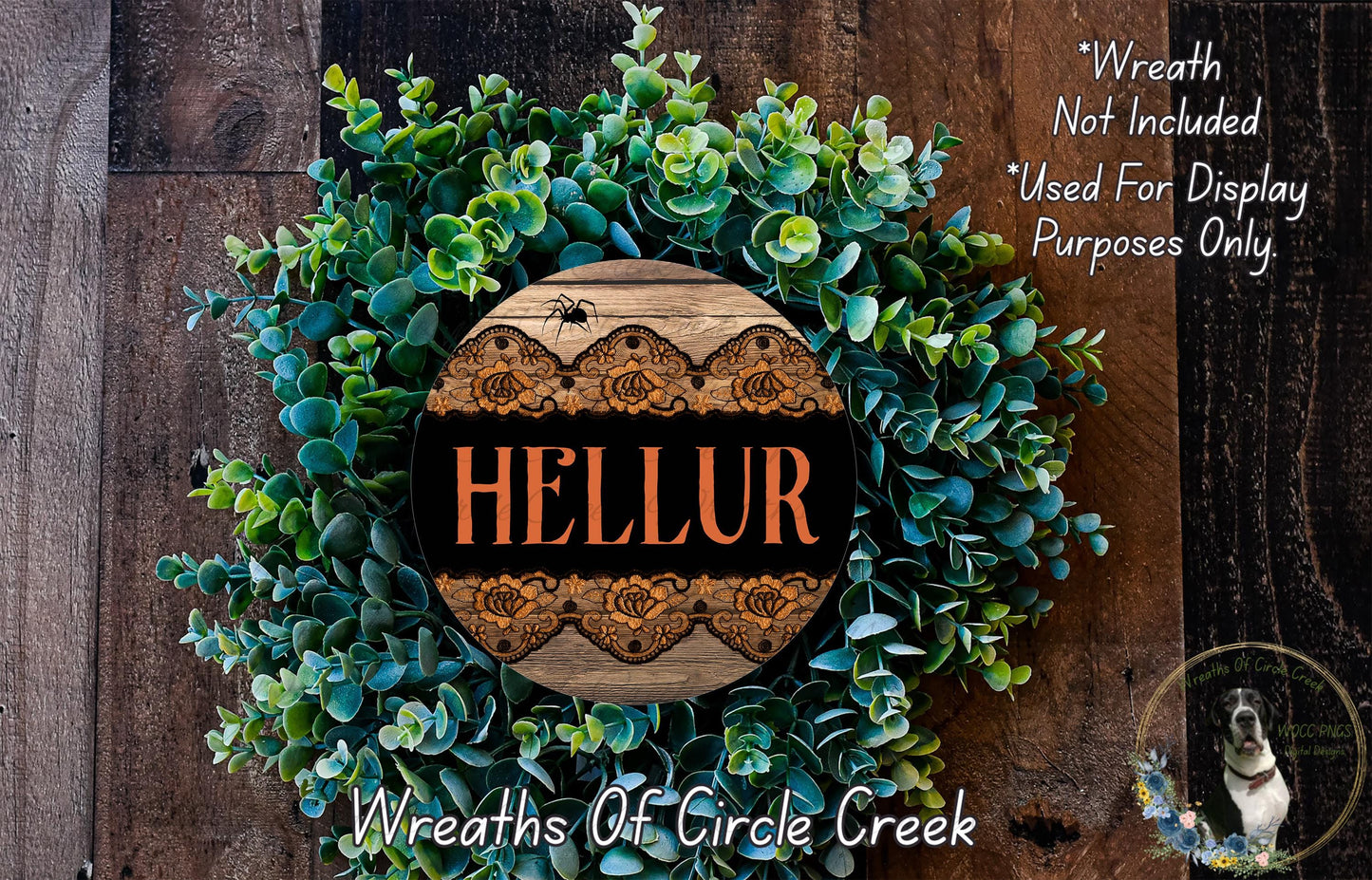 a wreath made of green leaves and a wooden sign with the word "HELLUR" on it, placed on a wooden surface.