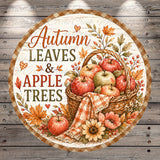 A round wooden sign with a basket of apples and autumn leaves, surrounded by flowers and leaves, conveying the theme of autumn.