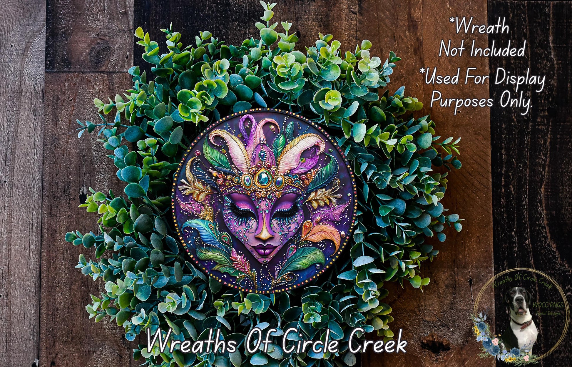 A wreath made of green leaves and flowers, with a colorful face design in the center.