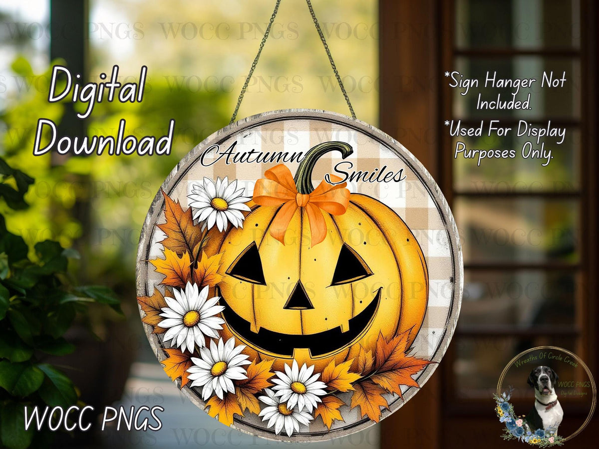 The image is a digital download of a Halloween-themed pumpkin decoration with a smiling face, surrounded by white flowers and autumn leaves.