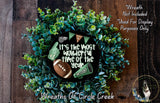 A wreath made of green foliage, with a football and cheerleading gear displayed on it. The wreath is surrounded by text that reads "It's the most wonderful time of the year" and "It's the most wonderful time of the year".