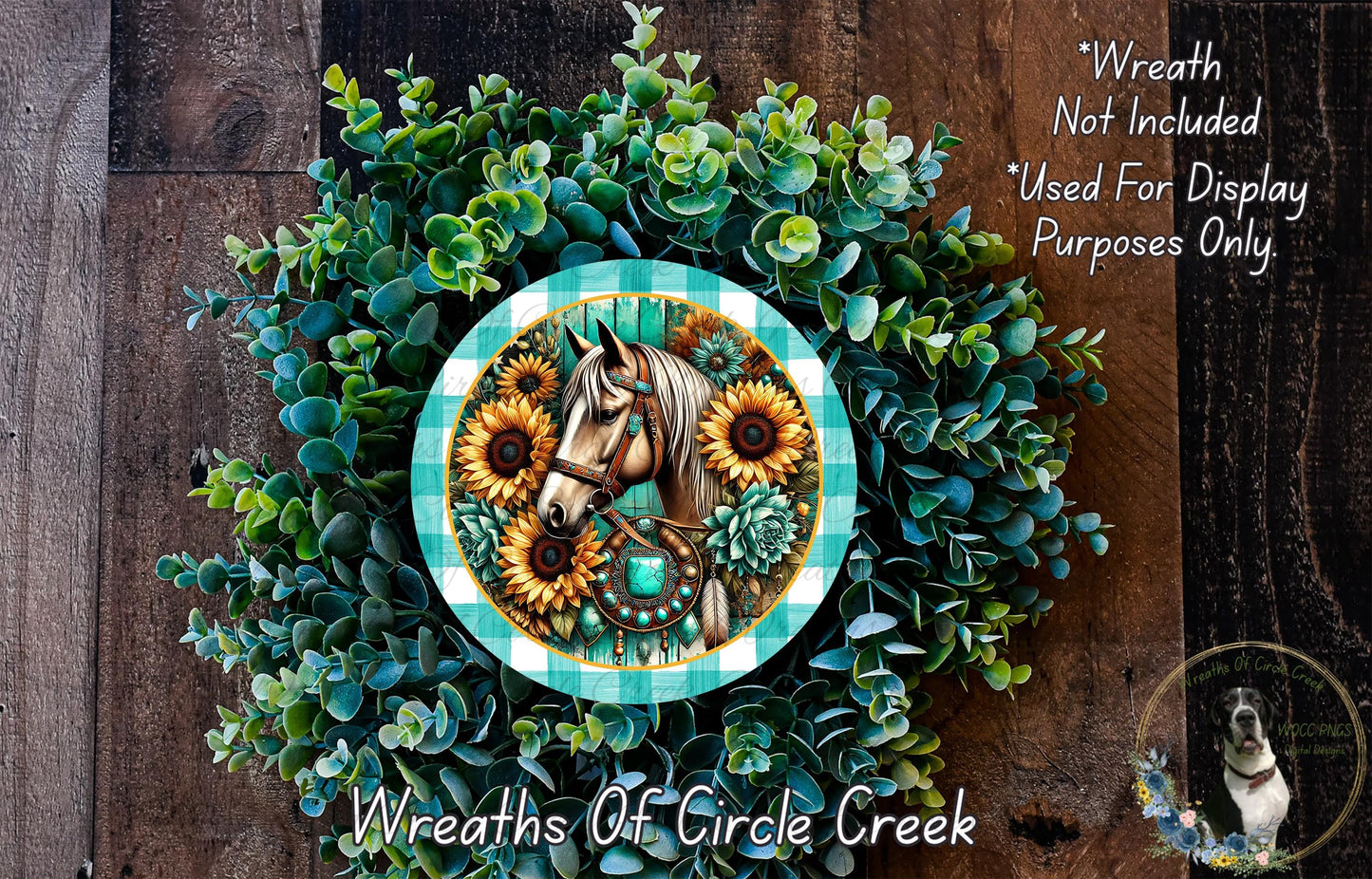 a wreath with a horse and sunflowers, surrounded by greenery. The wreath is placed on a wooden surface.