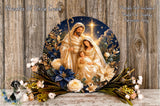 A decorative plate featuring a nativity scene with the Virgin Mary, baby Jesus, and the Holy Family, surrounded by flowers and greenery.
