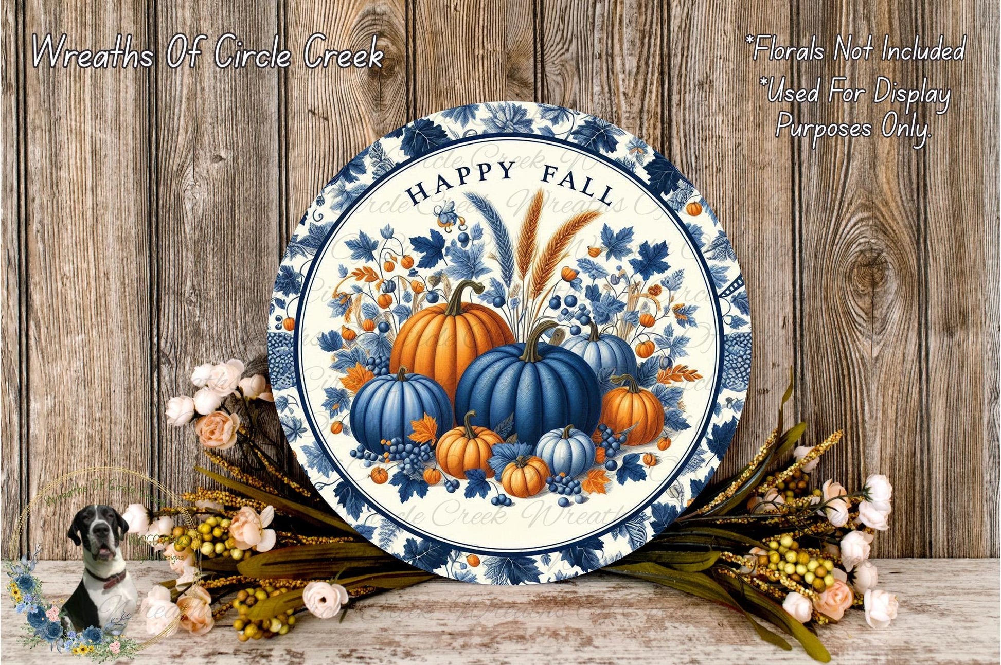 a blue and white plate with pumpkins on it