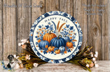 a blue and white plate with pumpkins on it