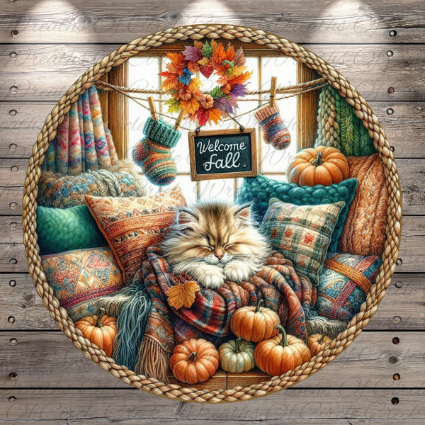 A cozy scene featuring a sleeping cat nestled among autumn-themed pillows and blankets, with a "Welcome Fall" sign hanging above and pumpkins scattered around the room.