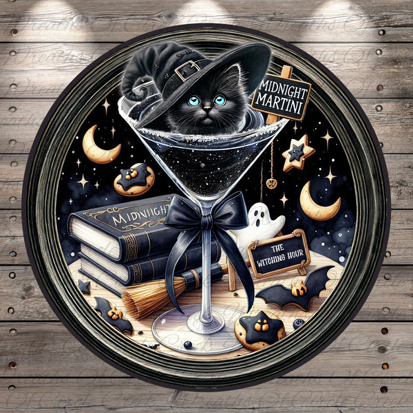 A black cat wearing a witch's hat is sitting in a martini glass, surrounded by Halloween-themed objects such as a book, broom, ghost, and bats.