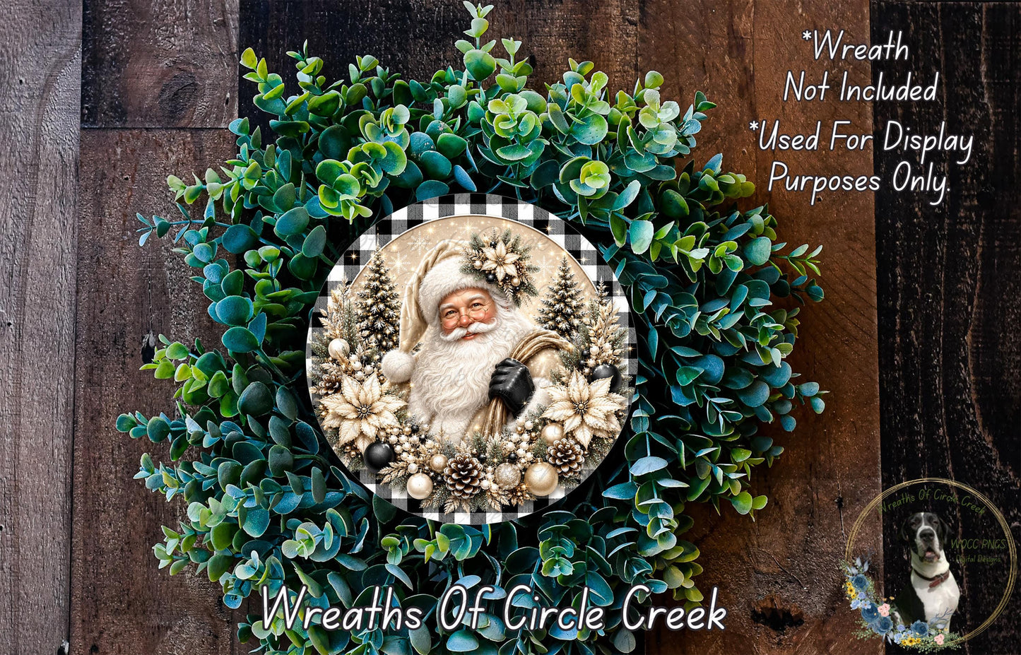 A wreath featuring a Santa Claus figure surrounded by greenery, with a plaque in the center displaying the Santa Claus image.