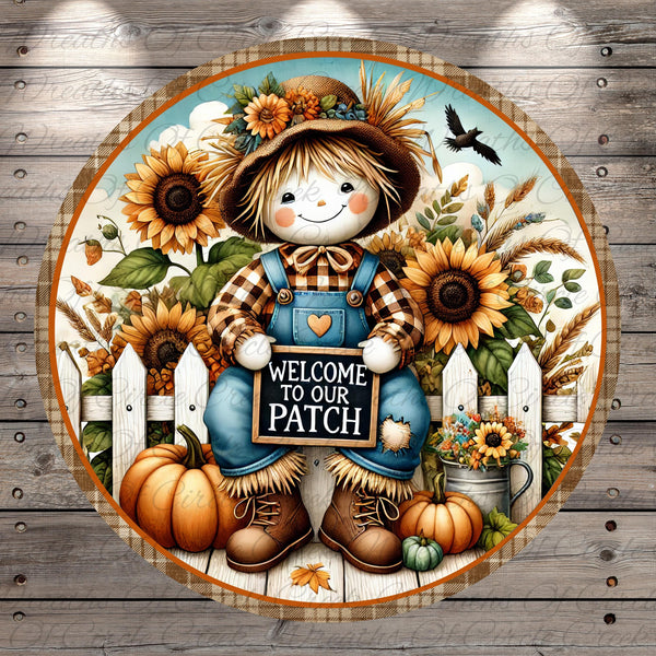 A cheerful scarecrow figure holding a "Welcome to our Patch" sign, surrounded by a rustic autumnal scene with sunflowers, pumpkins, and a wooden fence.