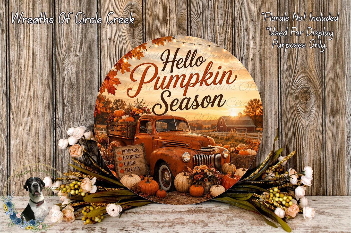 A round wooden sign with the text "Hello Pumpkin Season" and an image of a vintage truck surrounded by pumpkins and fall foliage.