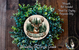 A wreath made of green foliage and a deer head, with the text "Buck Around and Find Out" and "Wreaths of Circle Creek" displayed on it.
