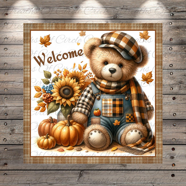 A teddy bear wearing a plaid hat and overalls, sitting next to a bouquet of sunflowers and pumpkins, with the word "Welcome" written above it.