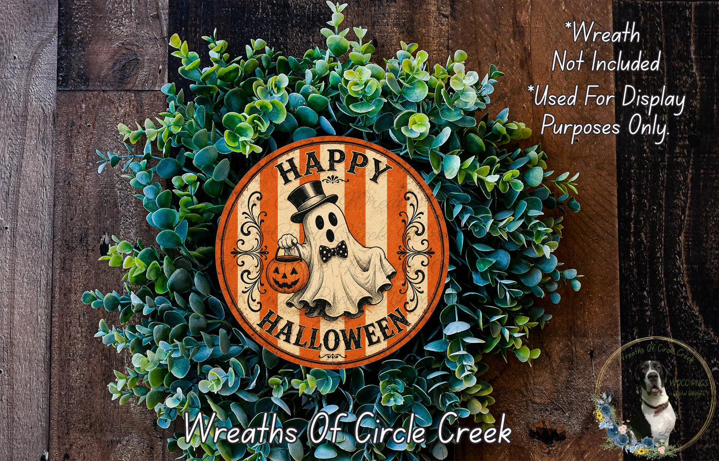 a Halloween wreath made of green foliage and an orange circular sign with a ghost and the text "Happy Halloween".