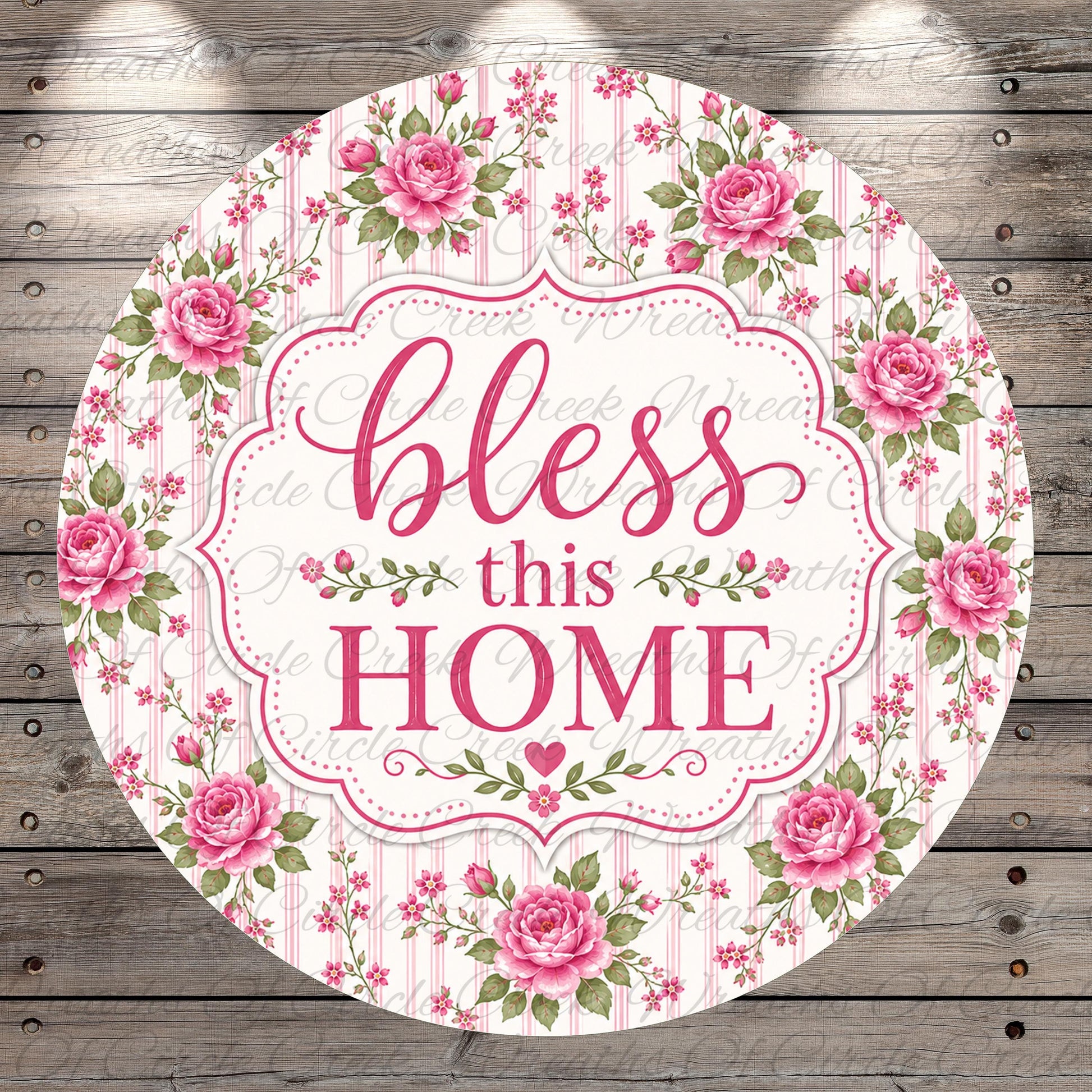 A round sign with a floral border and the text "bless this home" in pink and white.