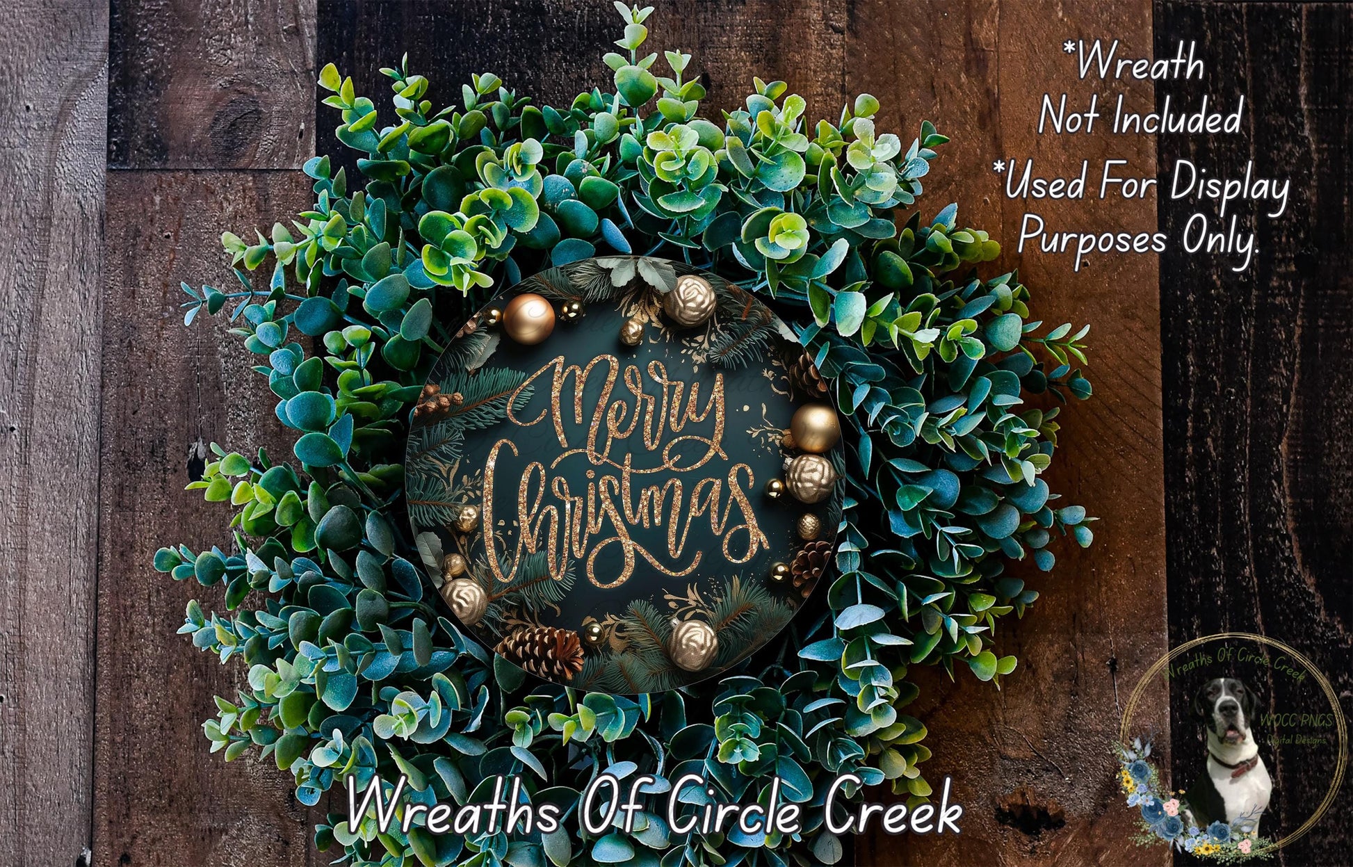 A wreath made of green and blue foliage, with a "Merry Christmas" sign in the center. The wreath is displayed on a wooden surface, and there is a text overlay that reads "Wreath Not Included * Used For Display Purposes Only".