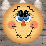 A cheerful, cartoon-like face with large blue eyes, a red nose, and a big smile, set against a wooden background.