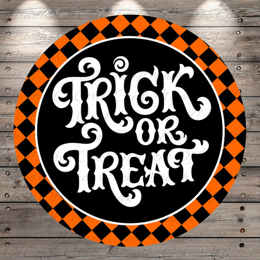 a circular sign with the text "TRICK or TREAT" written in an ornate, decorative font. The sign is surrounded by a checkered pattern in shades of orange and black, creating a festive and Halloween-themed design.