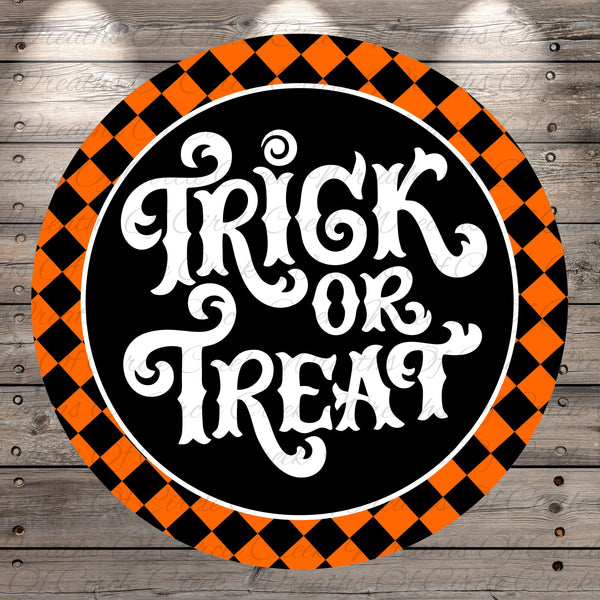 a circular sign with the text "TRICK or TREAT" written in an ornate, decorative font. The sign is surrounded by a checkered pattern in shades of orange and black, creating a festive and Halloween-themed design.