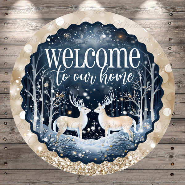 A circular sign with a winter scene featuring two deer standing in the snow, surrounded by snowflakes and trees. The sign has a text that reads &quot;Welcome to our home&quot;.