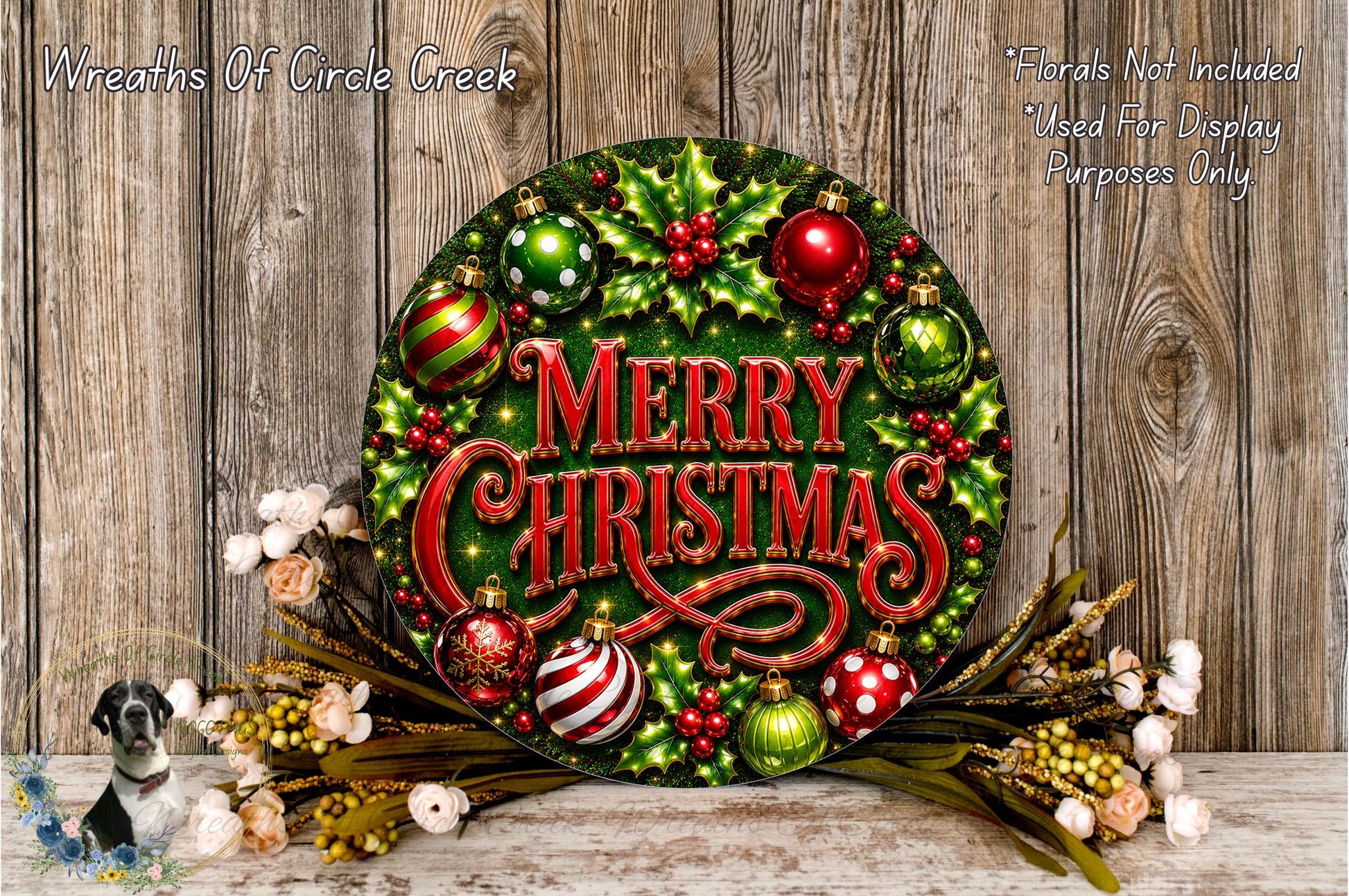 A festive Christmas wreath with the text "Merry Christmas" displayed prominently. The wreath is adorned with various ornaments, including red and green balls, and is surrounded by a floral arrangement. The background is a rustic wooden wall.