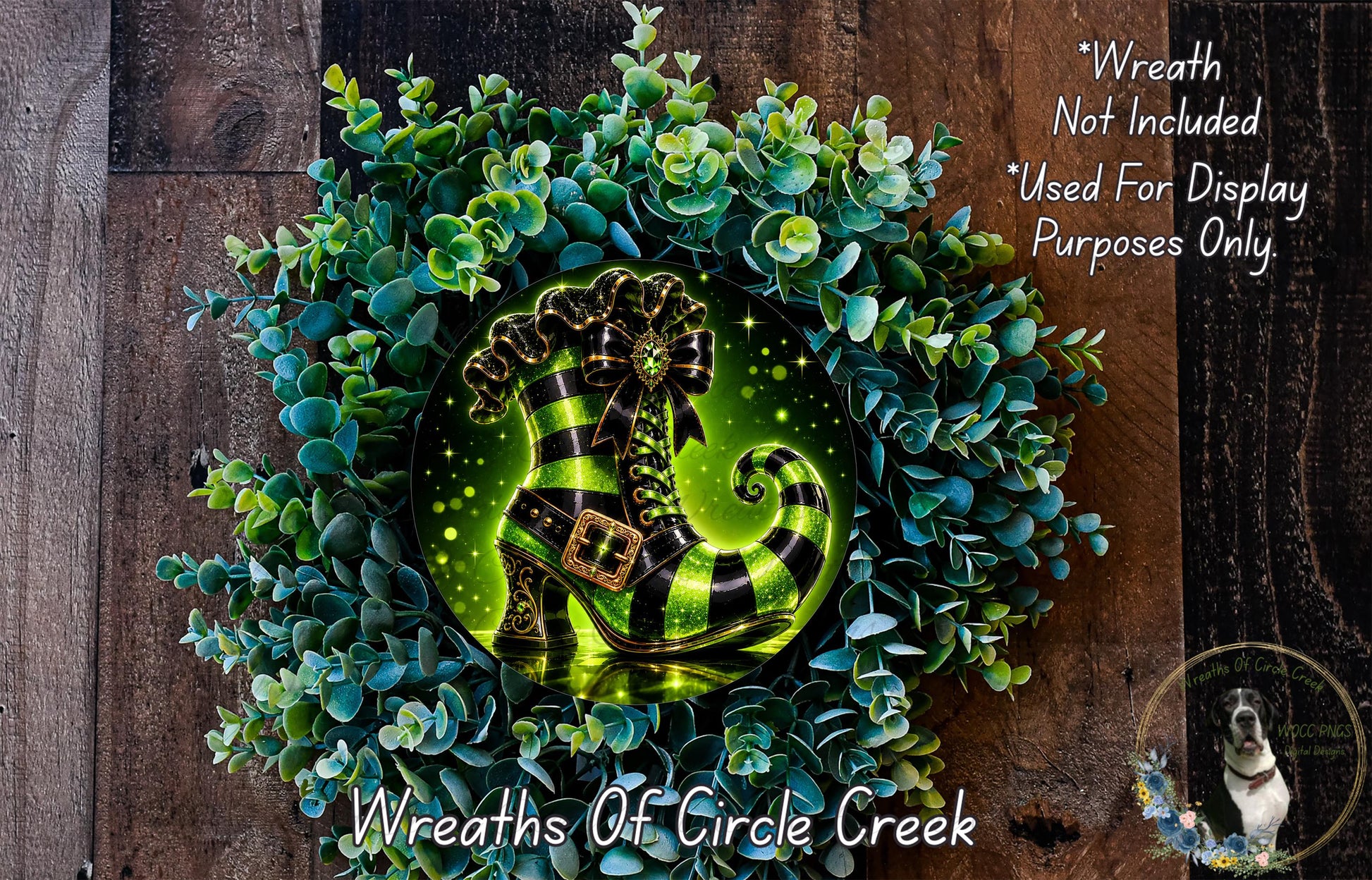 A wreath made of green and white eucalyptus leaves, with a glowing green shoe-shaped ornament in the center.