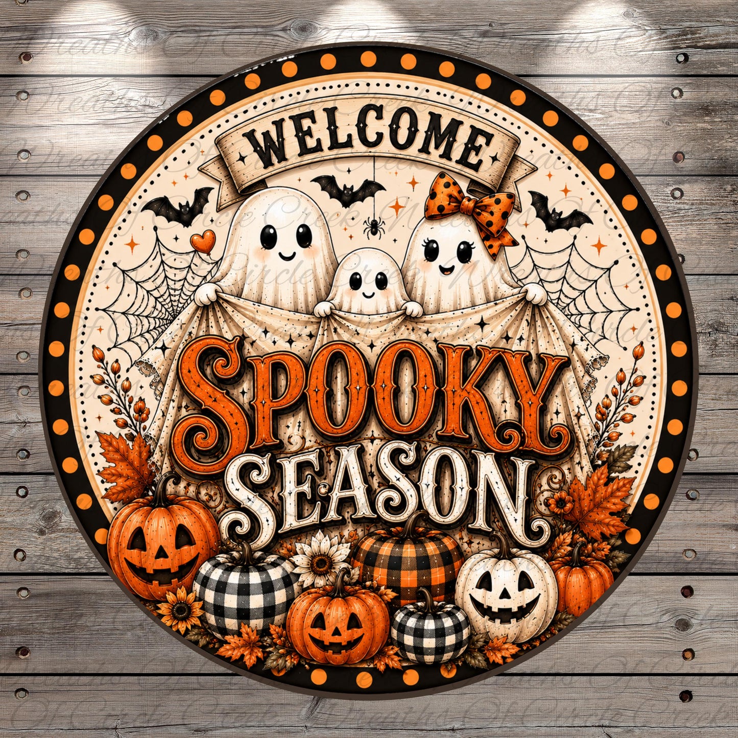 The image is a decorative Halloween-themed sign with a circular design featuring a "Welcome" banner, three ghostly figures, and various Halloween-themed elements such as pumpkins, bats, and spiderwebs.