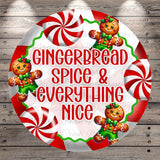 A circular design featuring a gingerbread man surrounded by red and white striped candy canes, with the text "Gingerbread Spice & Everything Nice" prominently displayed.
