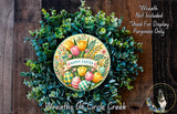 a wreath made of various green plants and colorful Easter eggs, with the text "Happy Easter" displayed on the wreath.