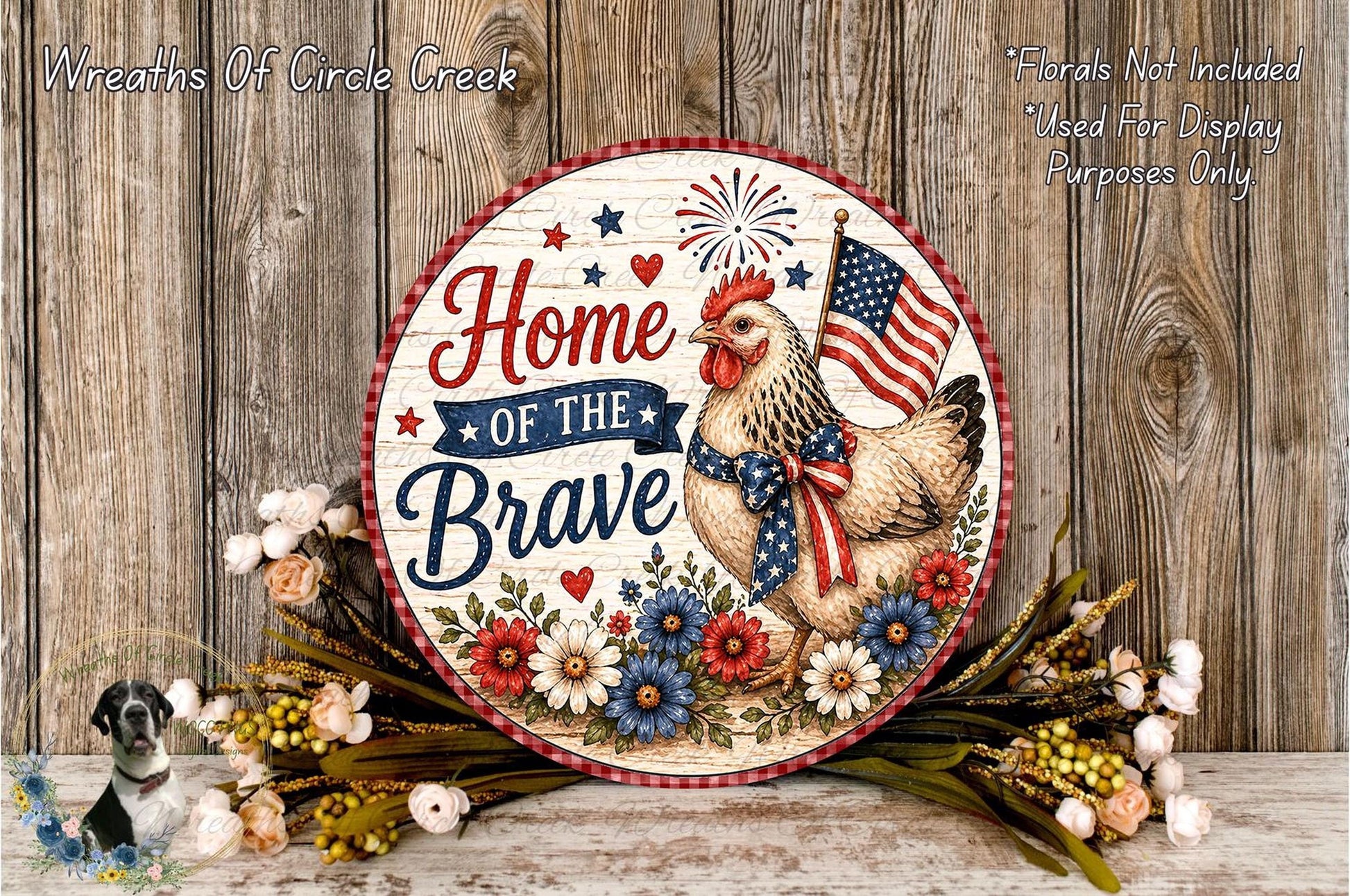 a decorative sign with a rooster and flowers, along with the text "Home of the Brave" and an American flag. The sign is placed on a wooden surface, surrounded by flowers.