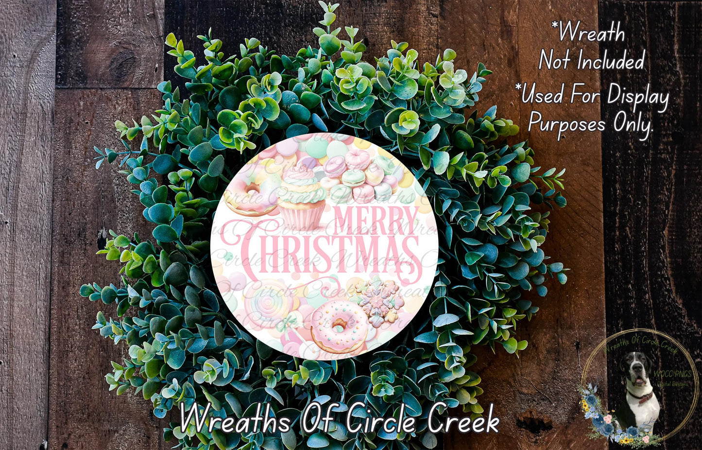 A wreath made of green leaves and colorful donuts, with the text "Merry Christmas" displayed on it.