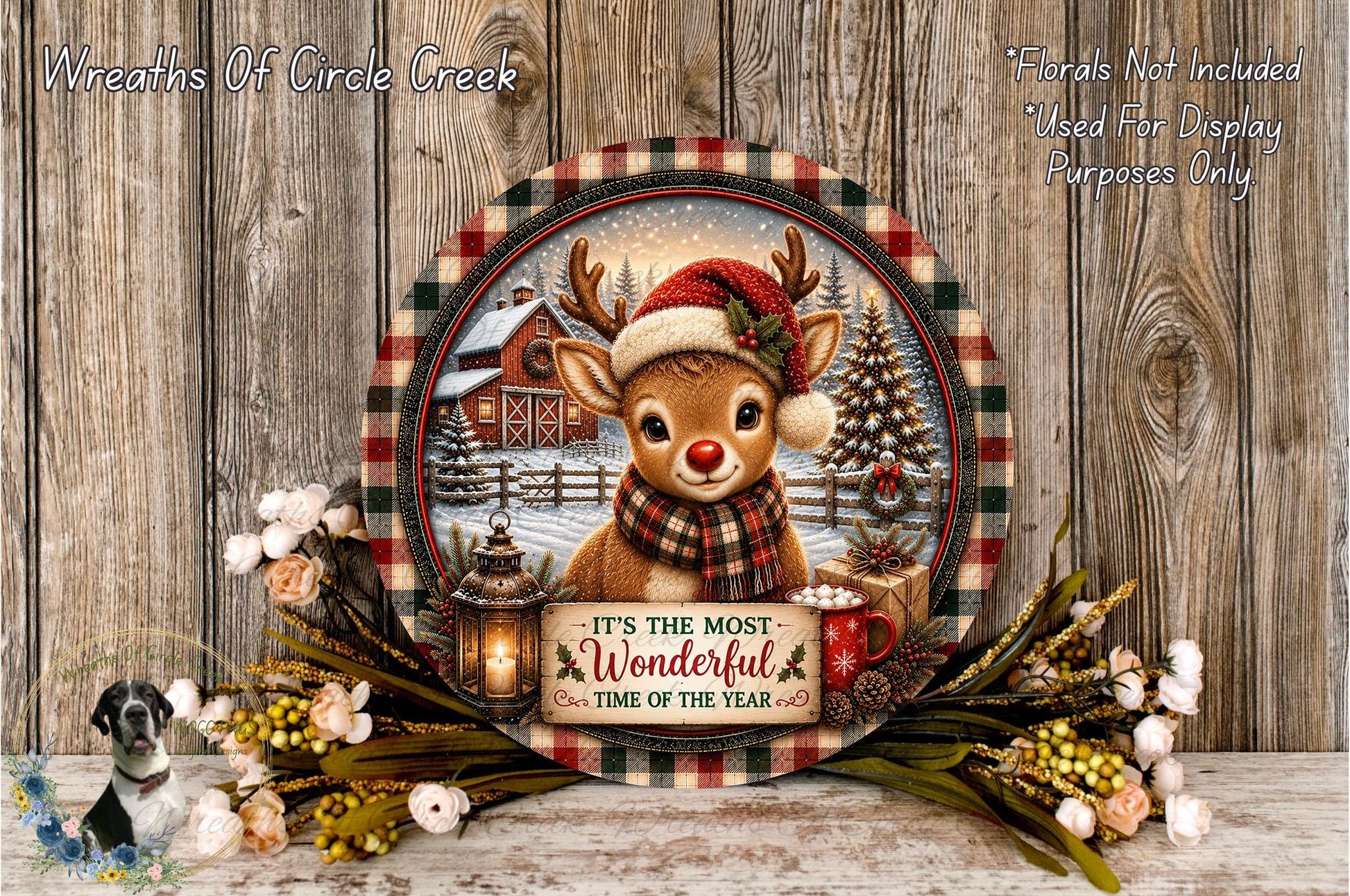 A decorative wreath featuring a reindeer wearing a Santa hat and scarf, surrounded by a floral arrangement and a sign that reads "It's the most Wonderful Time of the Year".