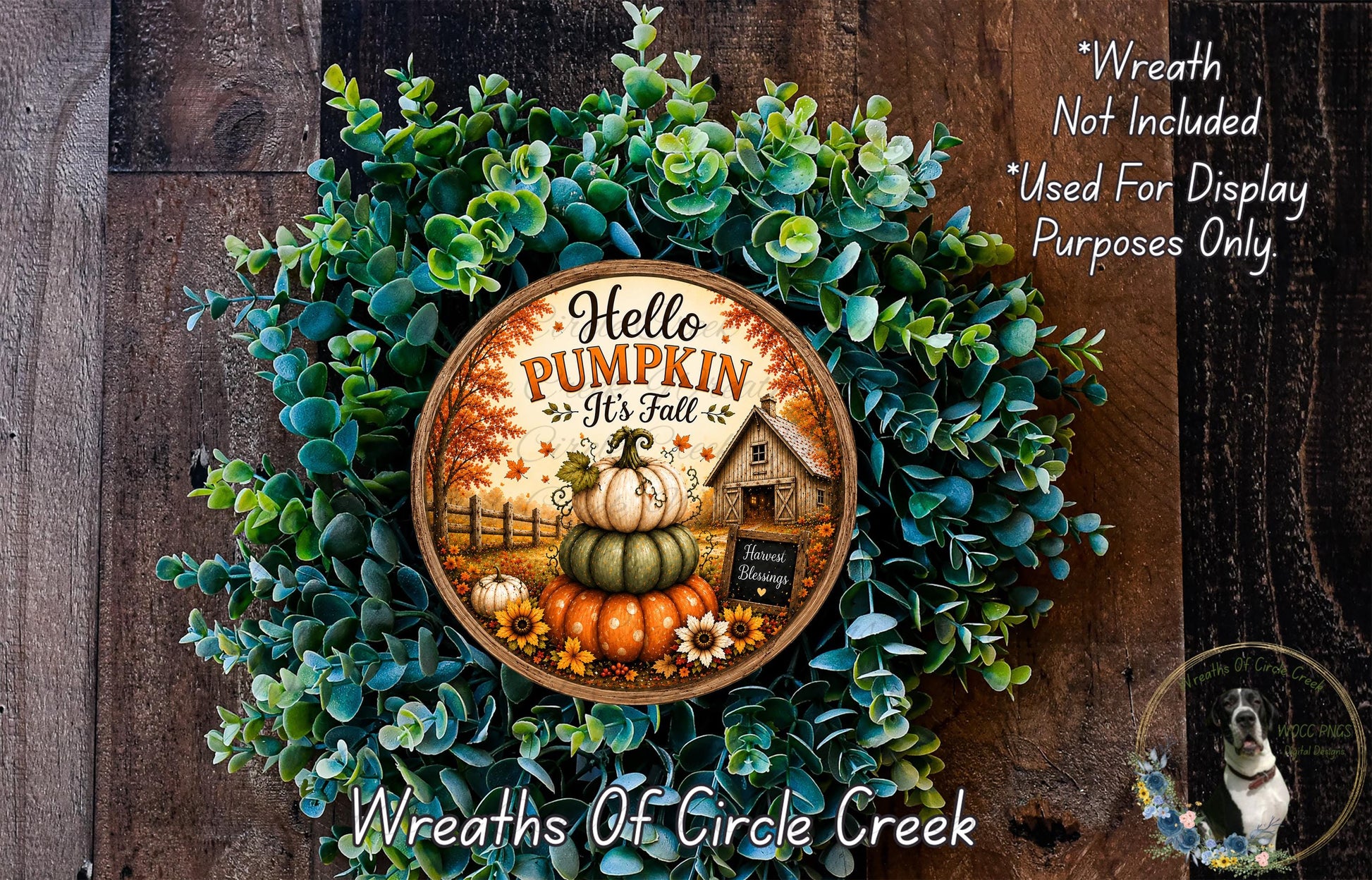 A wreath made of green leaves and pumpkins, with a wooden sign that says "Hello Pumpkin It's Fall".