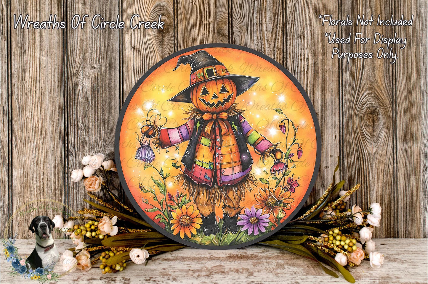 a Halloween-themed wreath with a jack-o-lantern figure, surrounded by flowers and greenery.