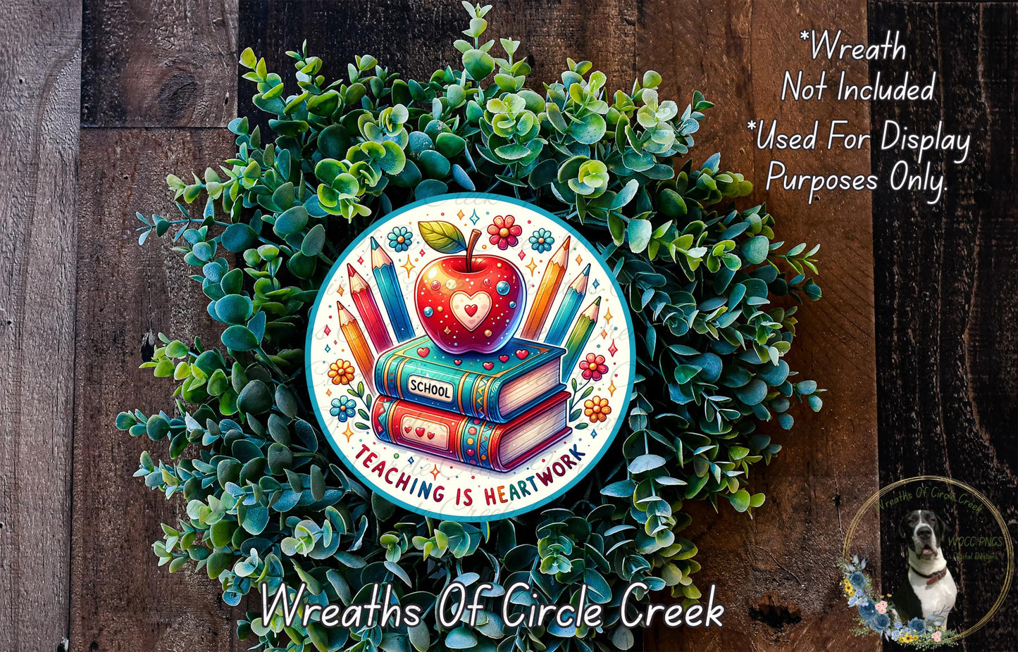 a wreath with a book and apple on it