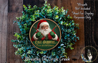 a Christmas wreath with a Santa Claus figure in the center, surrounded by a lush green wreath. The wreath is displayed on a wooden background, and there is a text overlay that reads "Knit Happens... Even at Christmas" and "Wreaths of Circle Creek".