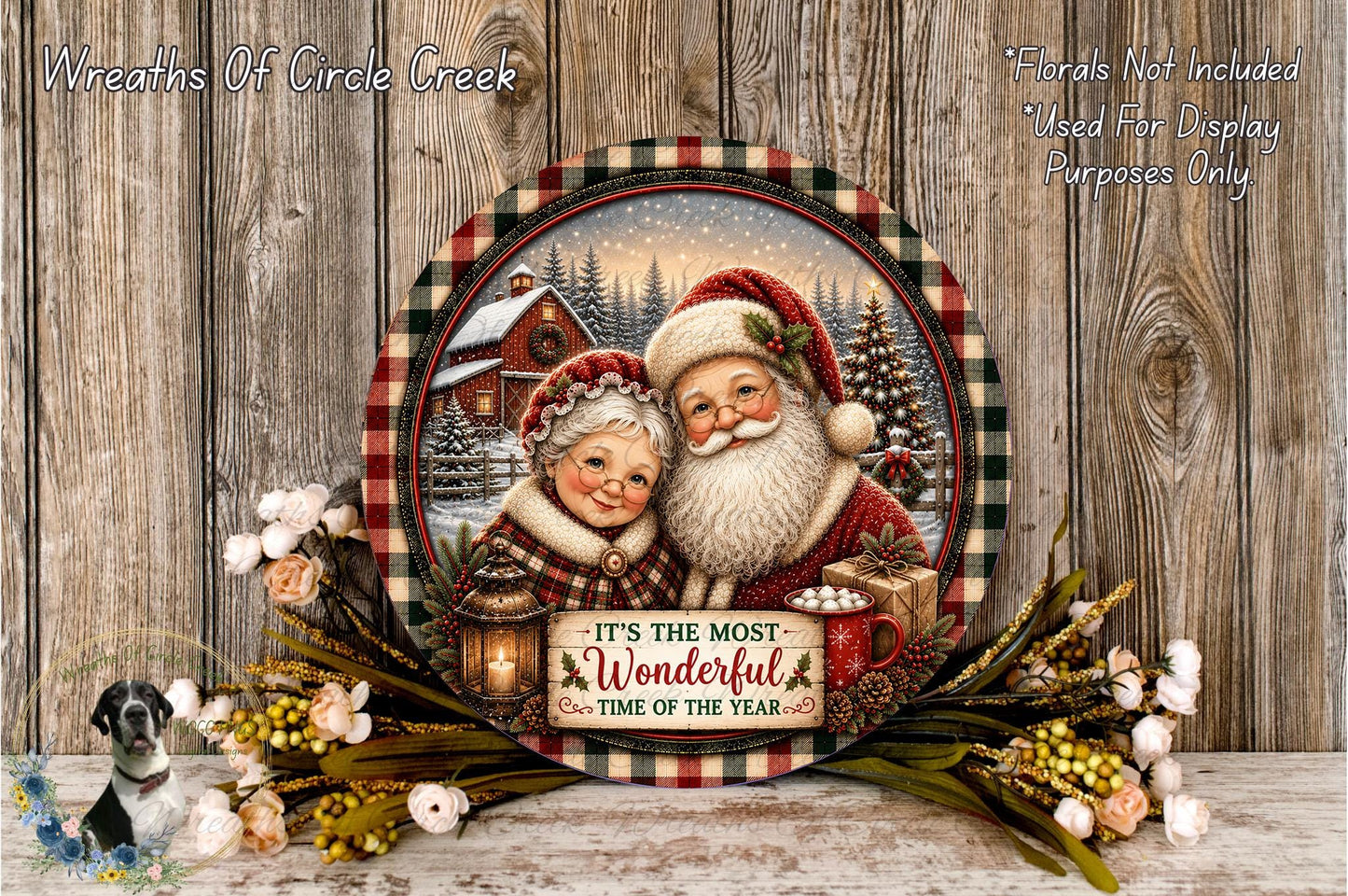 A decorative plate featuring a painting of Santa Claus and an elderly woman, surrounded by a wreath of flowers and a sign that reads "It's the most wonderful time of the year".