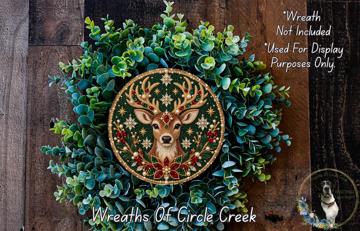 A decorative wreath made of green leaves and a deer head with antlers, featuring a gold and red design.