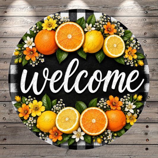A circular welcome sign with the word "welcome" written in cursive font, surrounded by various fruits such as oranges, lemons, and flowers.