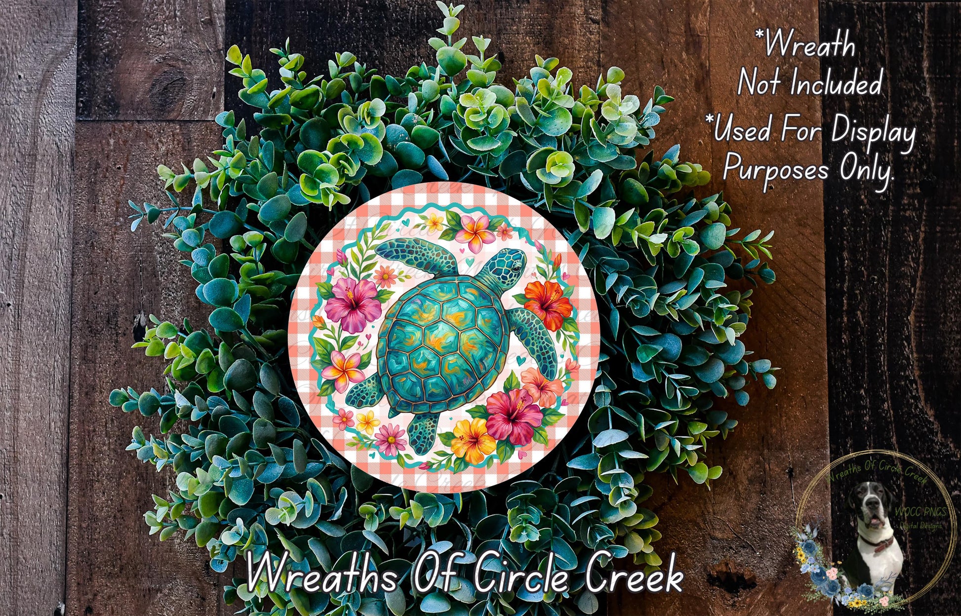 A wreath made of various green plants and flowers, with a large circular design featuring a turtle surrounded by colorful flowers.