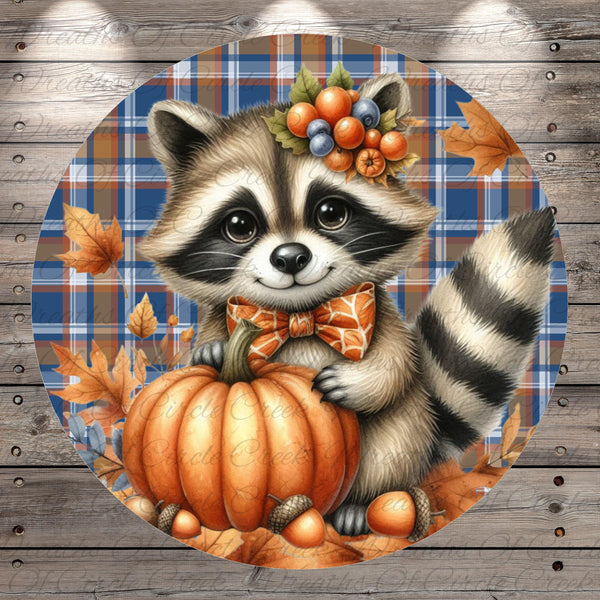 A raccoon wearing a bow tie and holding a pumpkin is surrounded by autumn leaves and a plaid background.