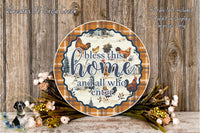 a decorative plate with a plaid pattern and a message that says "bless this home and all who enter." The plate is surrounded by a floral arrangement and placed on a wooden surface.