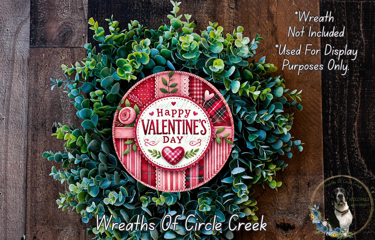 A wreath made of green leaves and flowers, with a red and white sign that says "Happy Valentine's Day". The wreath is displayed on a wooden surface, and there is a text overlay that reads "Wreath Not Included * Used For Display Purposes Only".